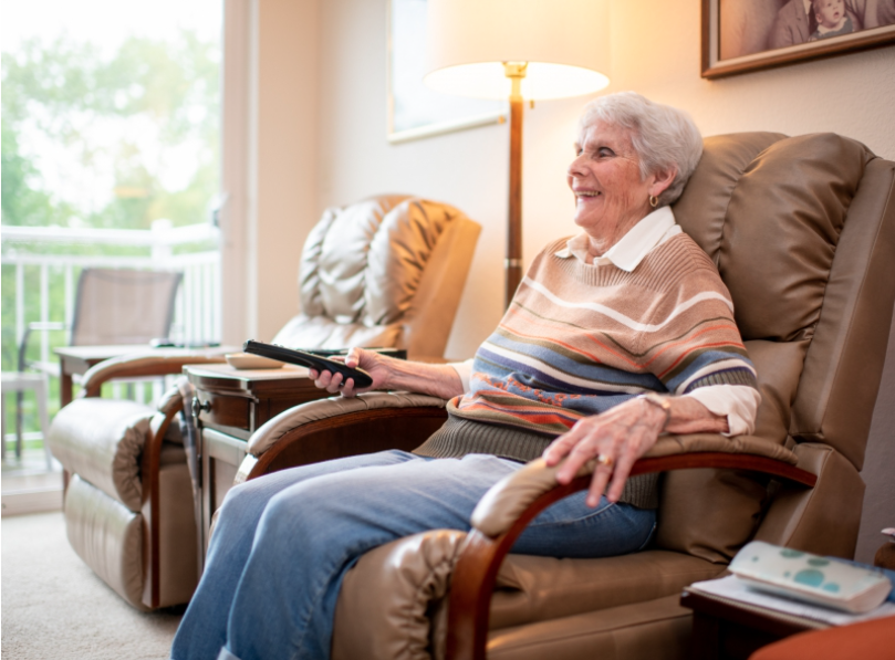 Elderly Woman Relaxing in Chair - Kingsley Shores Senior Living